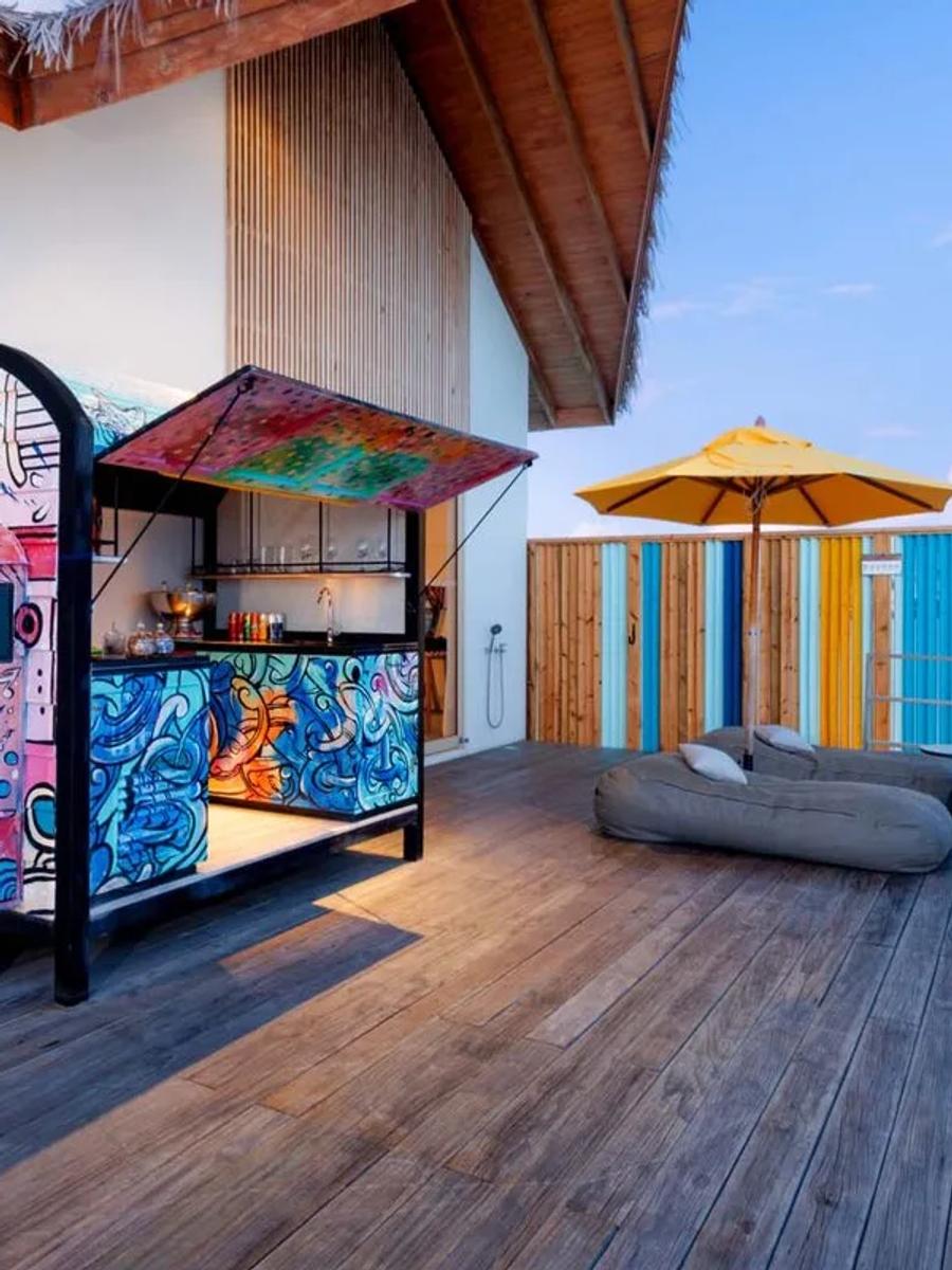 The Rock Star Villa's deck, with its signature tuk-tuk bar and a glimpse of its private pool