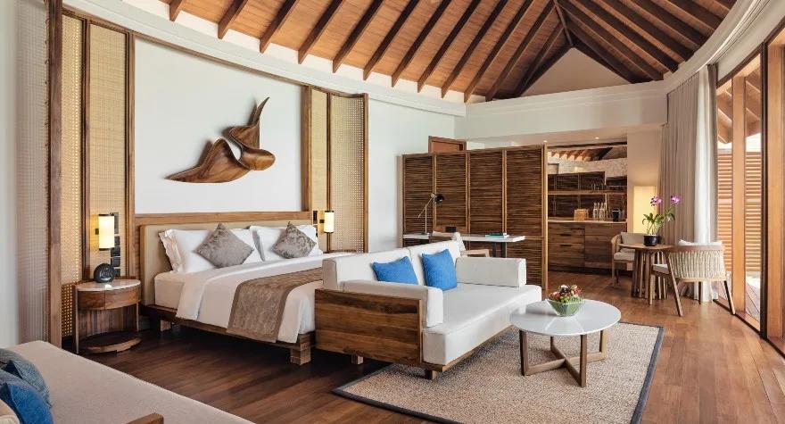 Bedroom interior of a Sunset Over Water Suite at Anantara Dhigu
