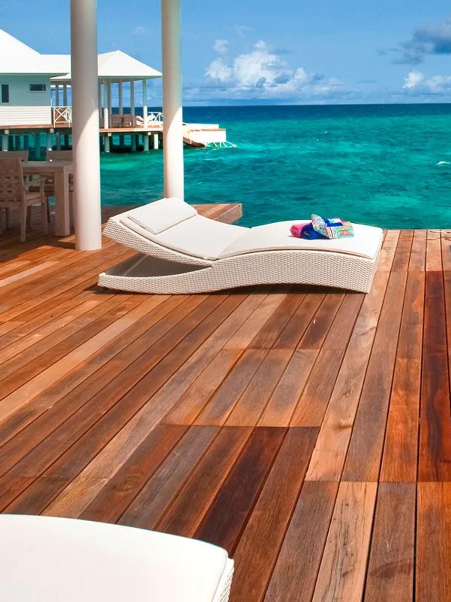 The deck and jacuzzi tub of a Jacuzzi Water Villa, positioned directly over the reef