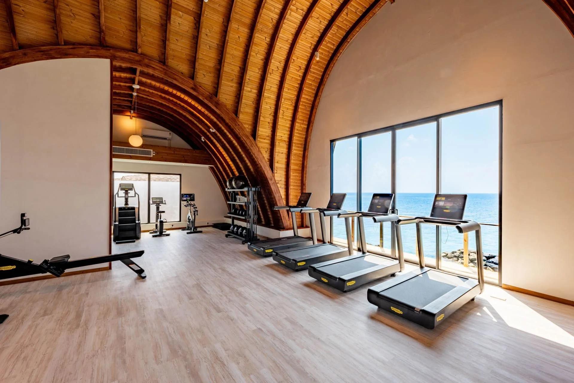Kandu Spa's second-floor gym, ocean-view treadmills lined along the water side