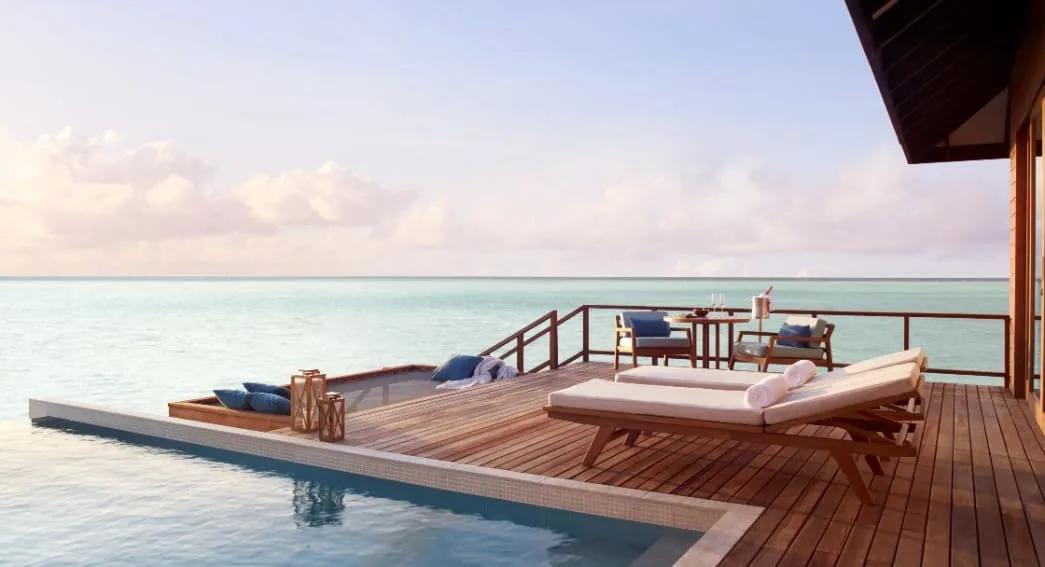 Aerial view of two Deluxe Over Water Pool Villas with their private pools over the lagoon