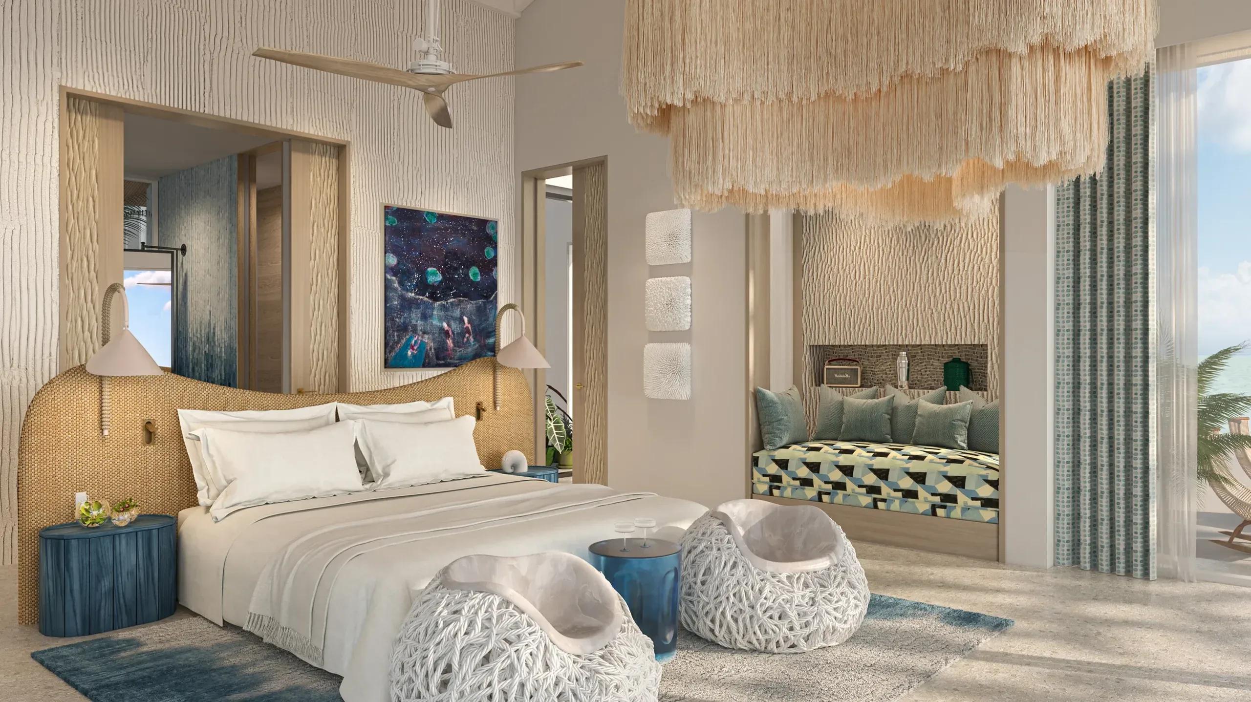 A bedroom in the Lagoon Residence at .Here, glass doors opening onto the deck with the lagoon beyond