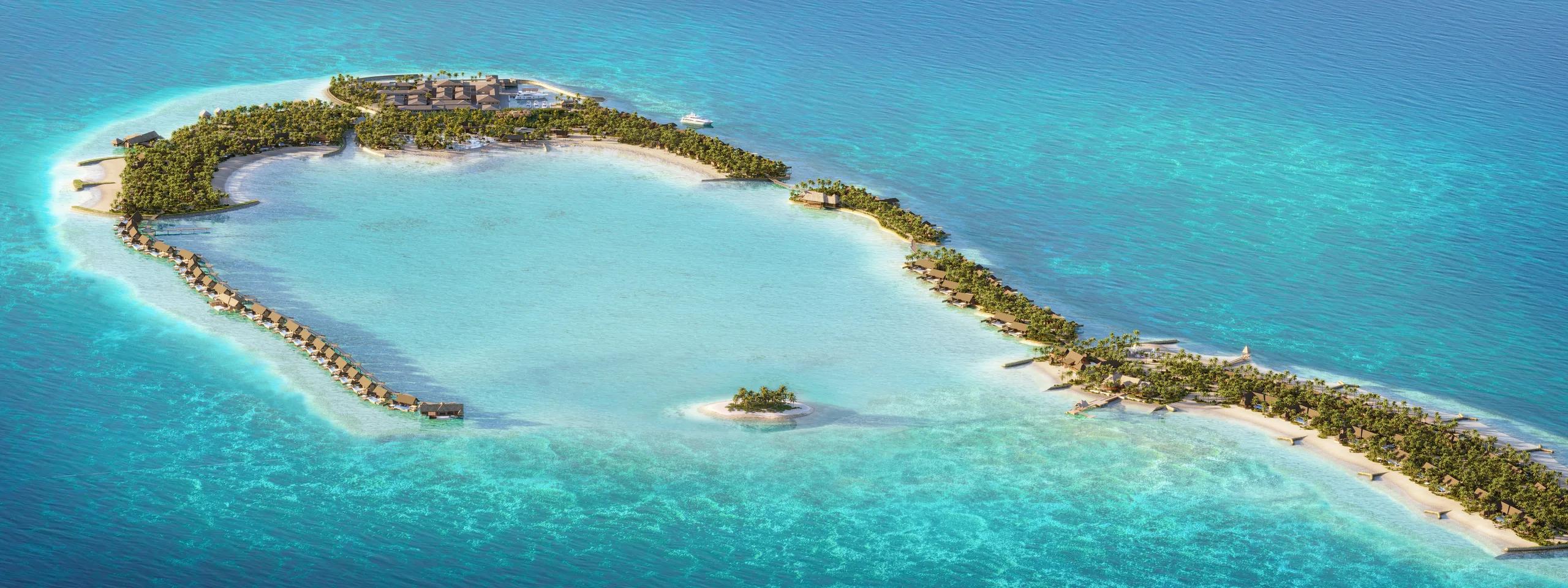 A wide aerial view of Waldorf Astoria Maldives Ithaafushi, its villas ringed by lagoon and reef