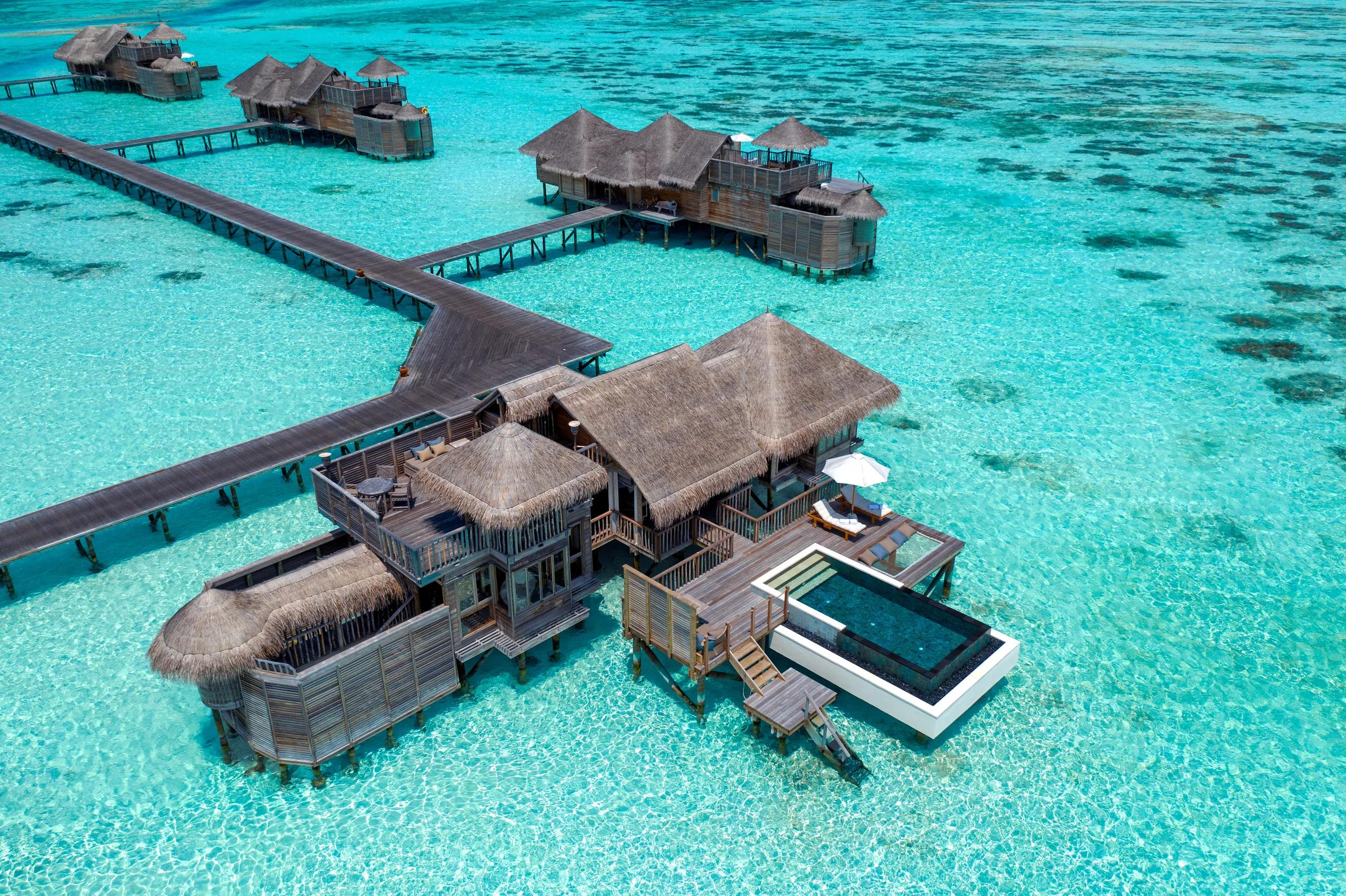 Aerial view of a Villa Suite with Pool, one of Gili Lankanfushi's overwater villas set in the lagoon