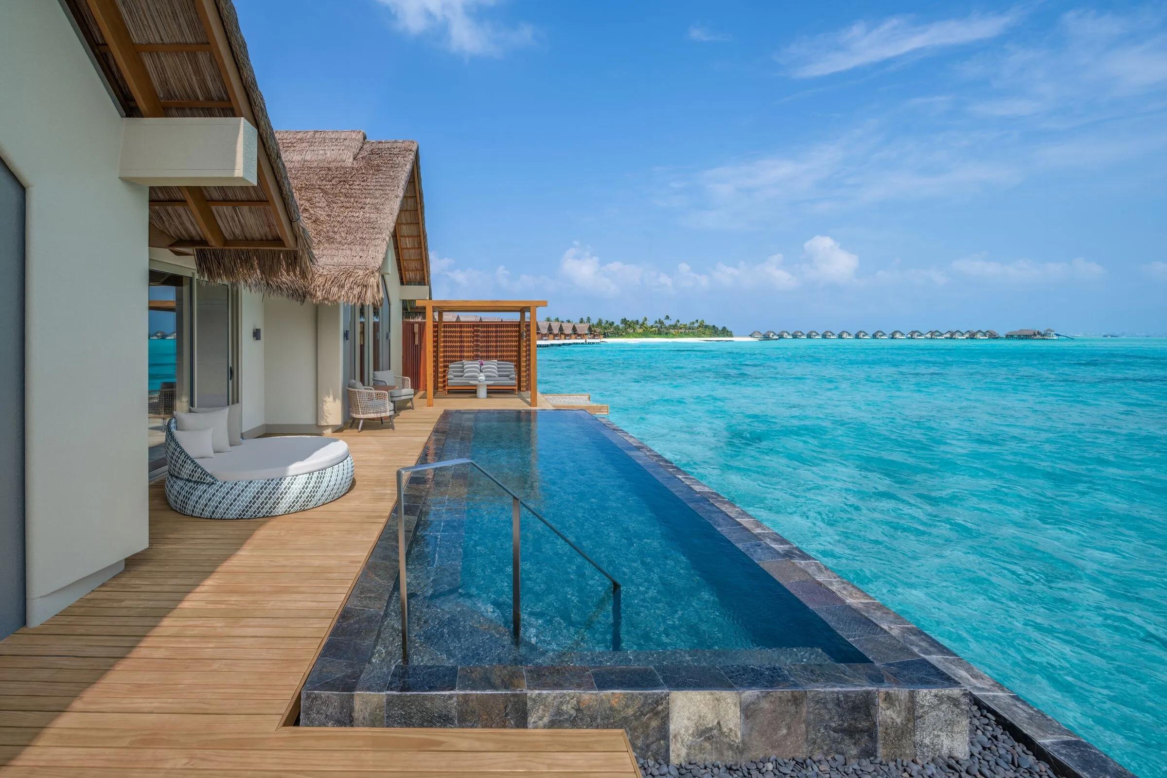A Beach Pool Villa's deck stepping down toward the pool