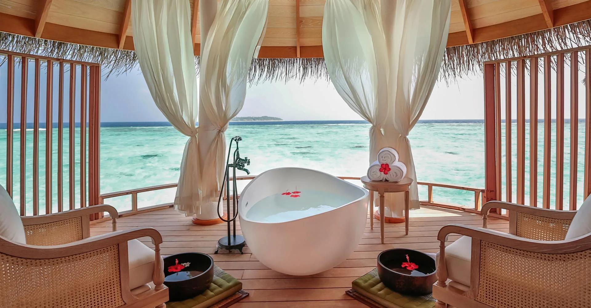 Serenity Spa's overwater deck at Milaidhoo, set above the lagoon.