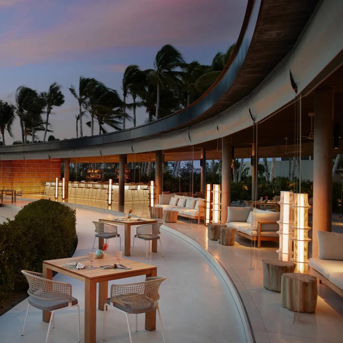 EAU Bar's lit terrace at dusk stands in for Tum Tum — no dedicated photography exists for this venue on the official site