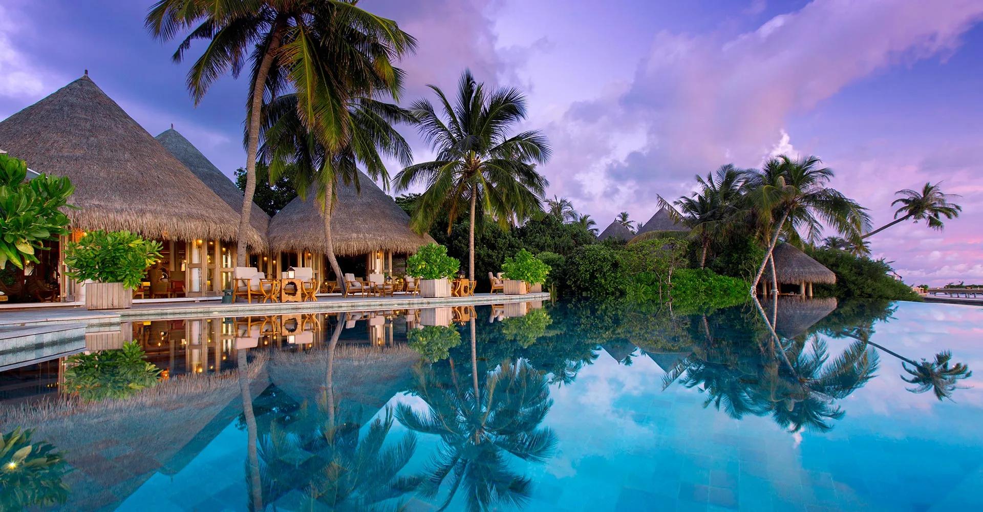 Compass Pool Bar at Milaidhoo, beside the resort's infinity pool.