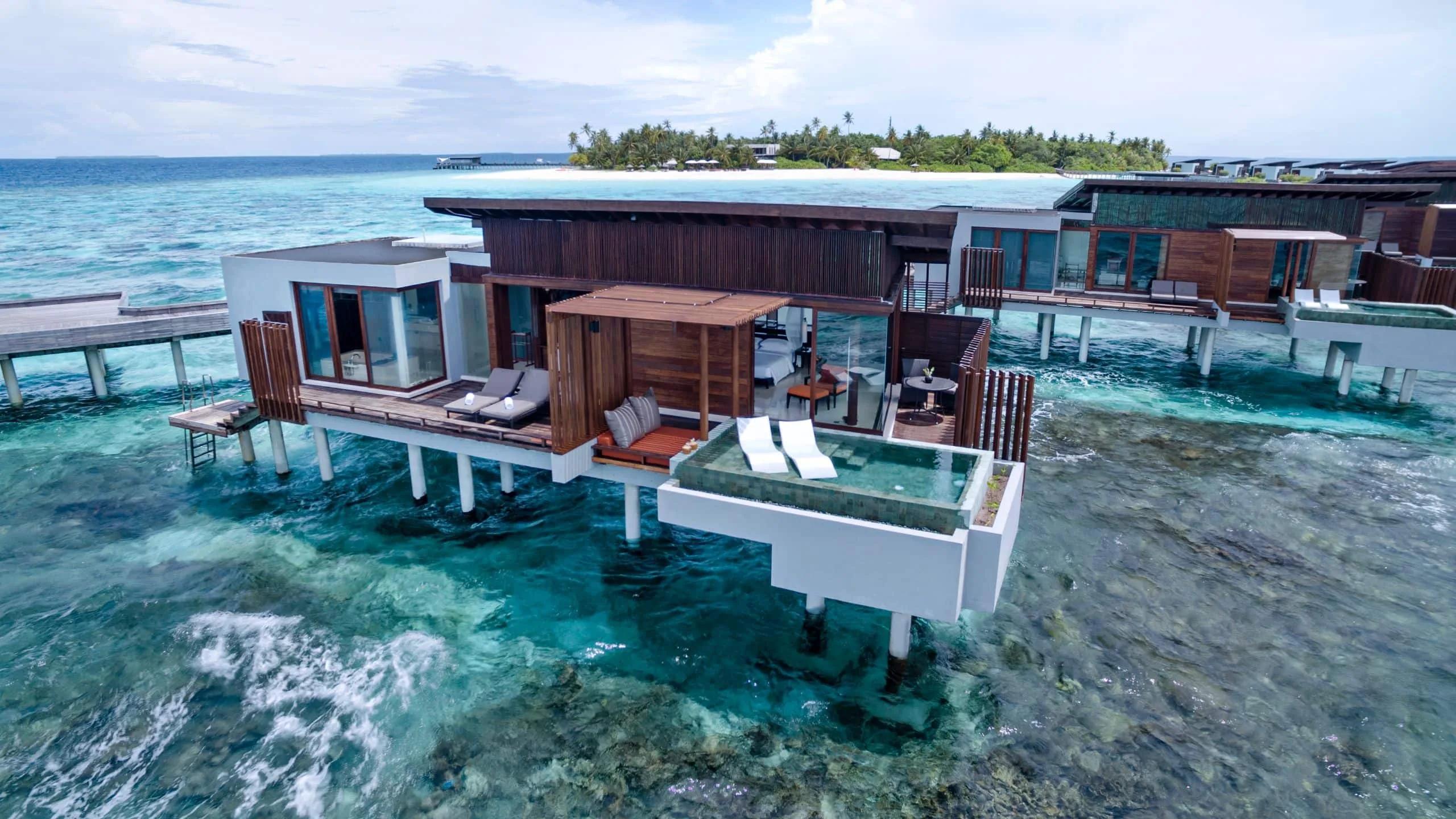 An Overwater Sunset Pool Villa with its plunge pool cantilevered over the reef