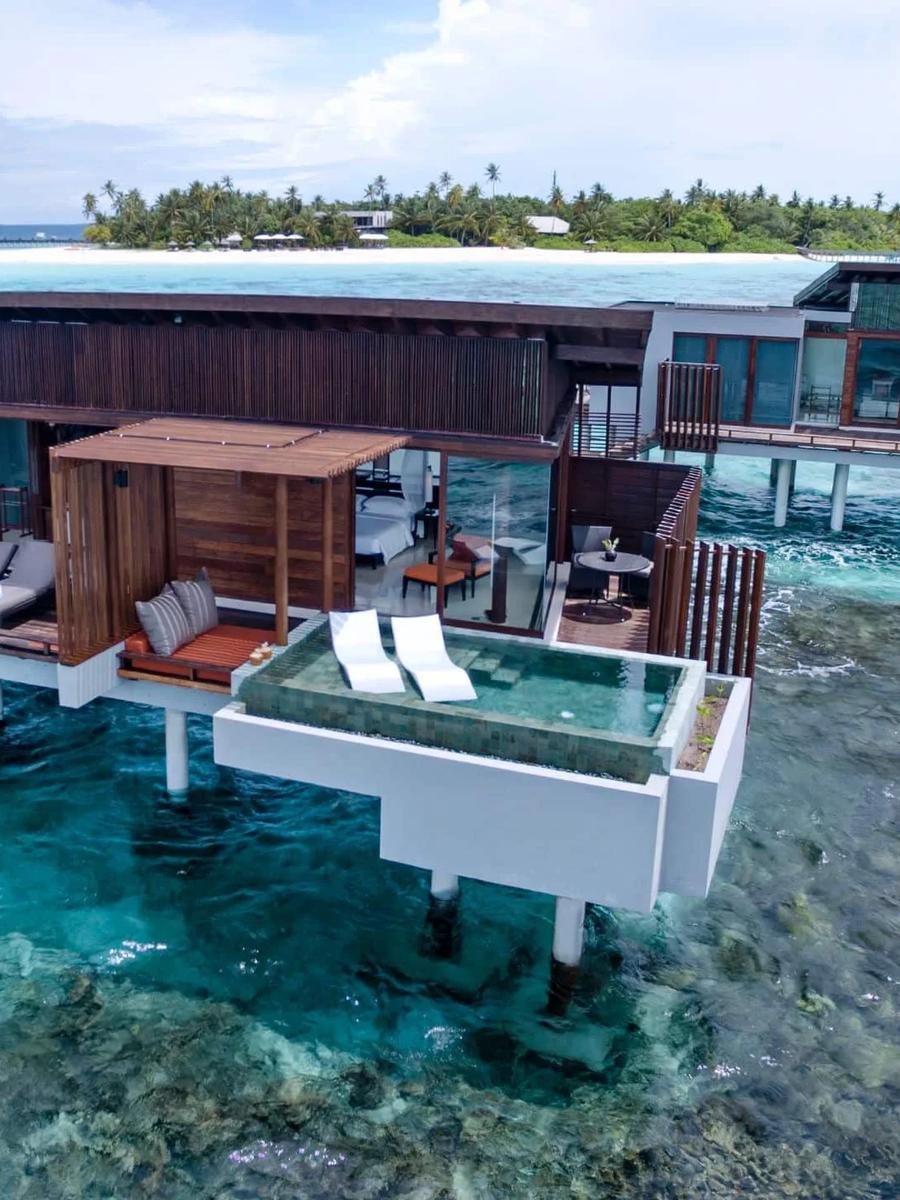 An Overwater Sunset Pool Villa with its plunge pool cantilevered over the reef