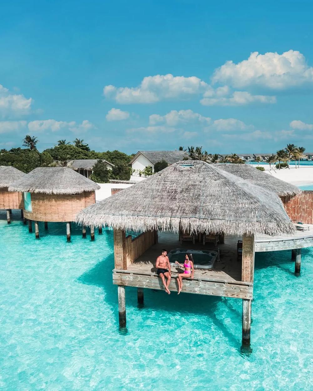 A golden-hour celebration at the water's edge in the Maldives