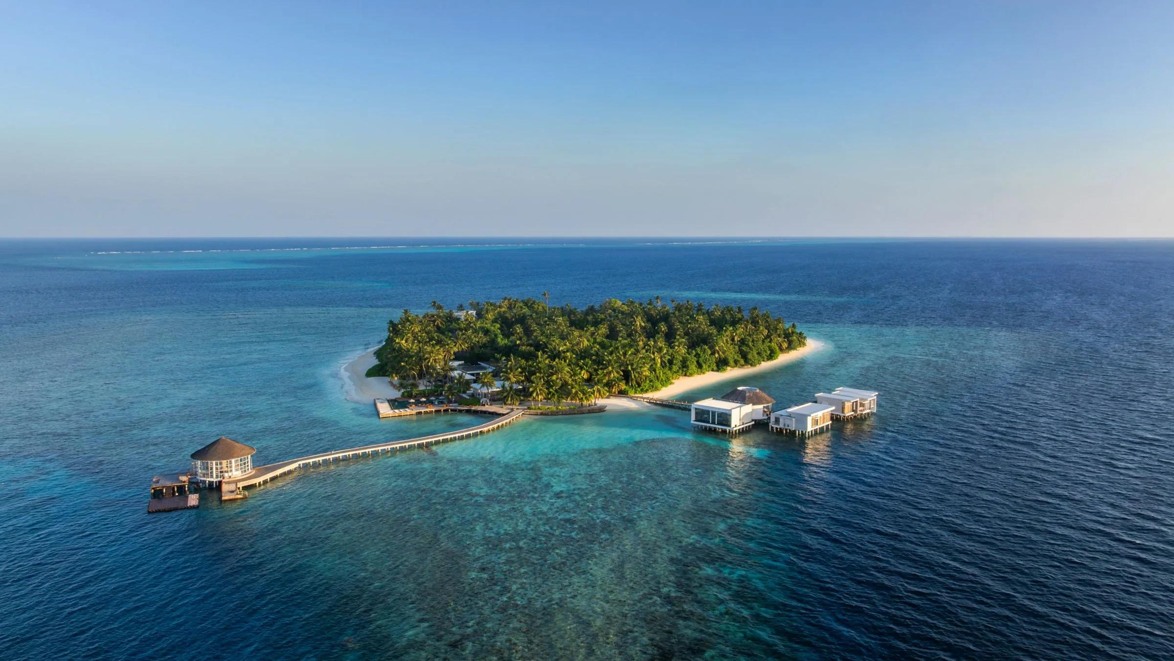 Aerial view of The Halcyon Private Isles Maldives across Gaafu Alifu Atoll's turquoise lagoon