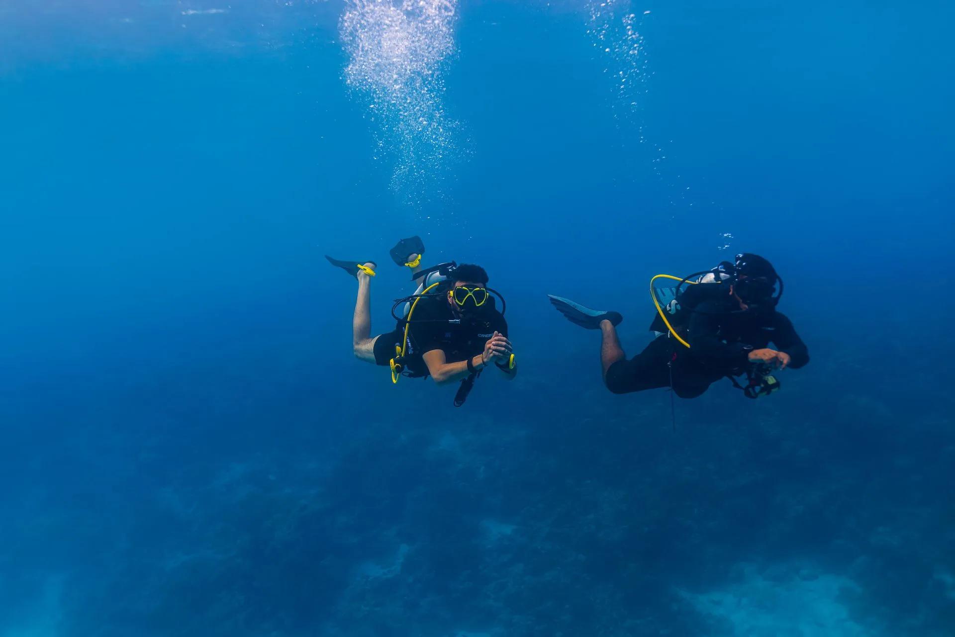 Divers preparing to enter the water near Heritance Aarah