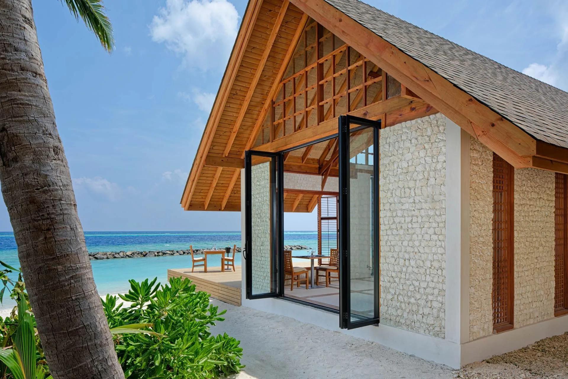 Asian Food Street's stone pavilion, folding glass doors open to the beach