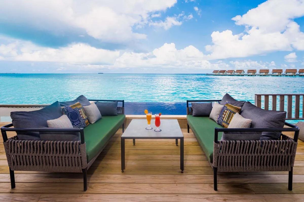 The Rock Royalty Overwater Private Pool Villa's exterior deck and private infinity pool over the lagoon