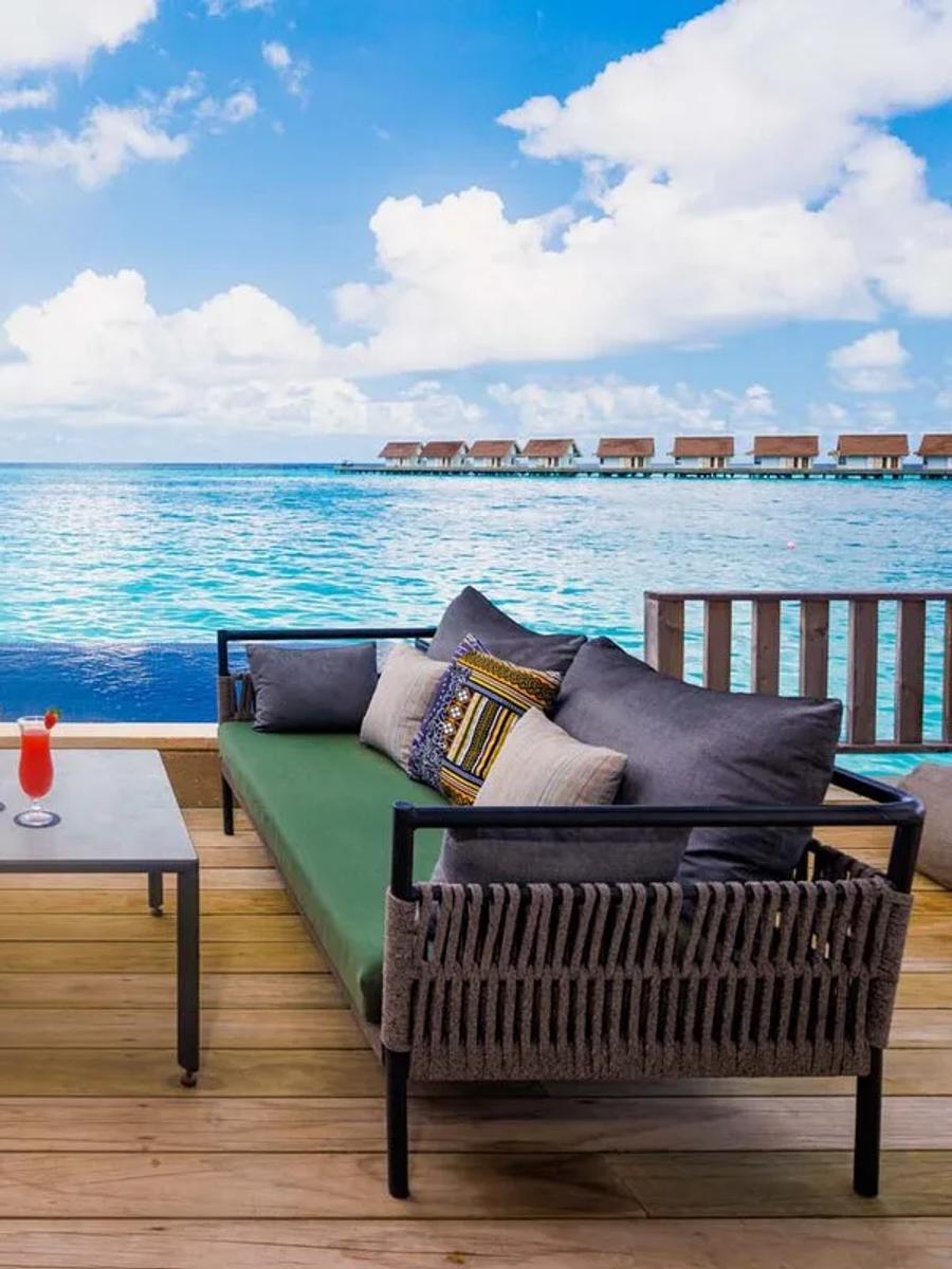 The Rock Royalty Overwater Private Pool Villa's exterior deck and private infinity pool over the lagoon