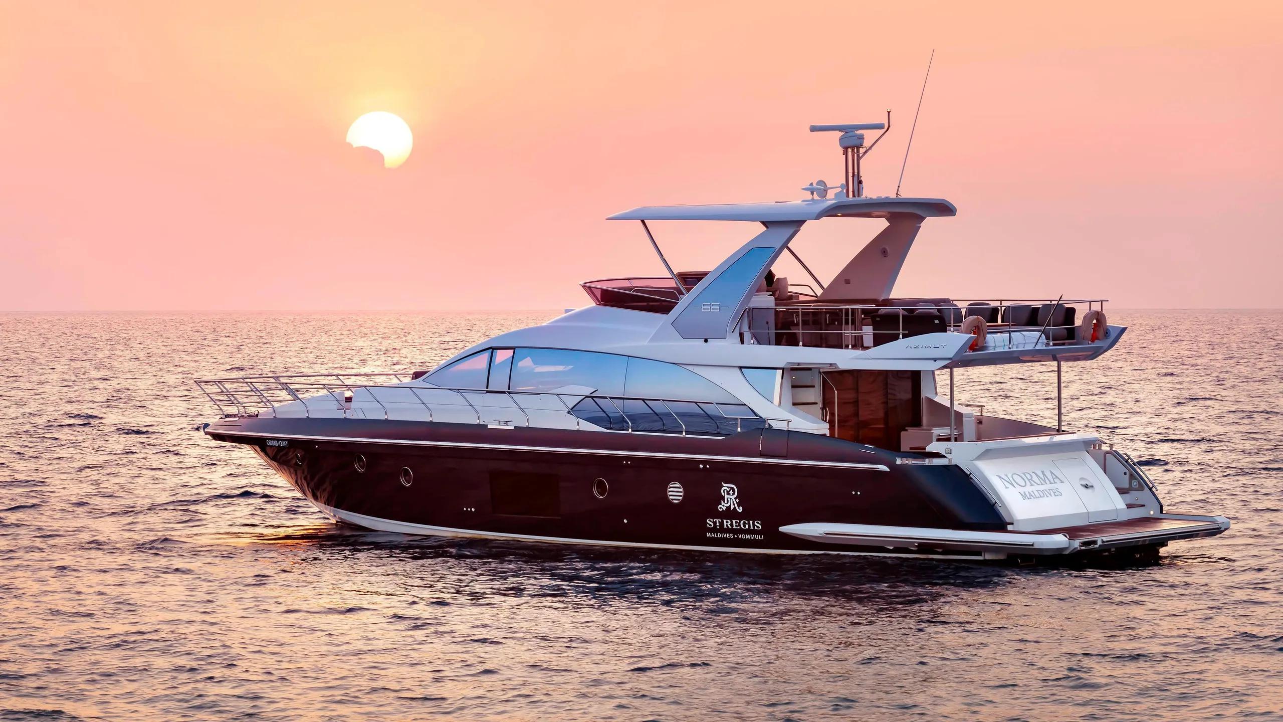 Norma, the resort's Azimut Flybridge 66 private yacht, at sunset