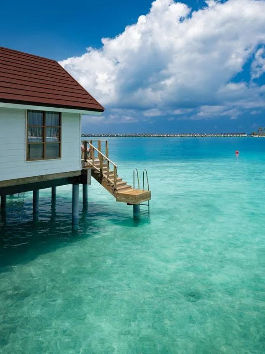 A Nest Water Villa at OBLU SELECT Lobigili, overwater with a private staircase down into the lagoon