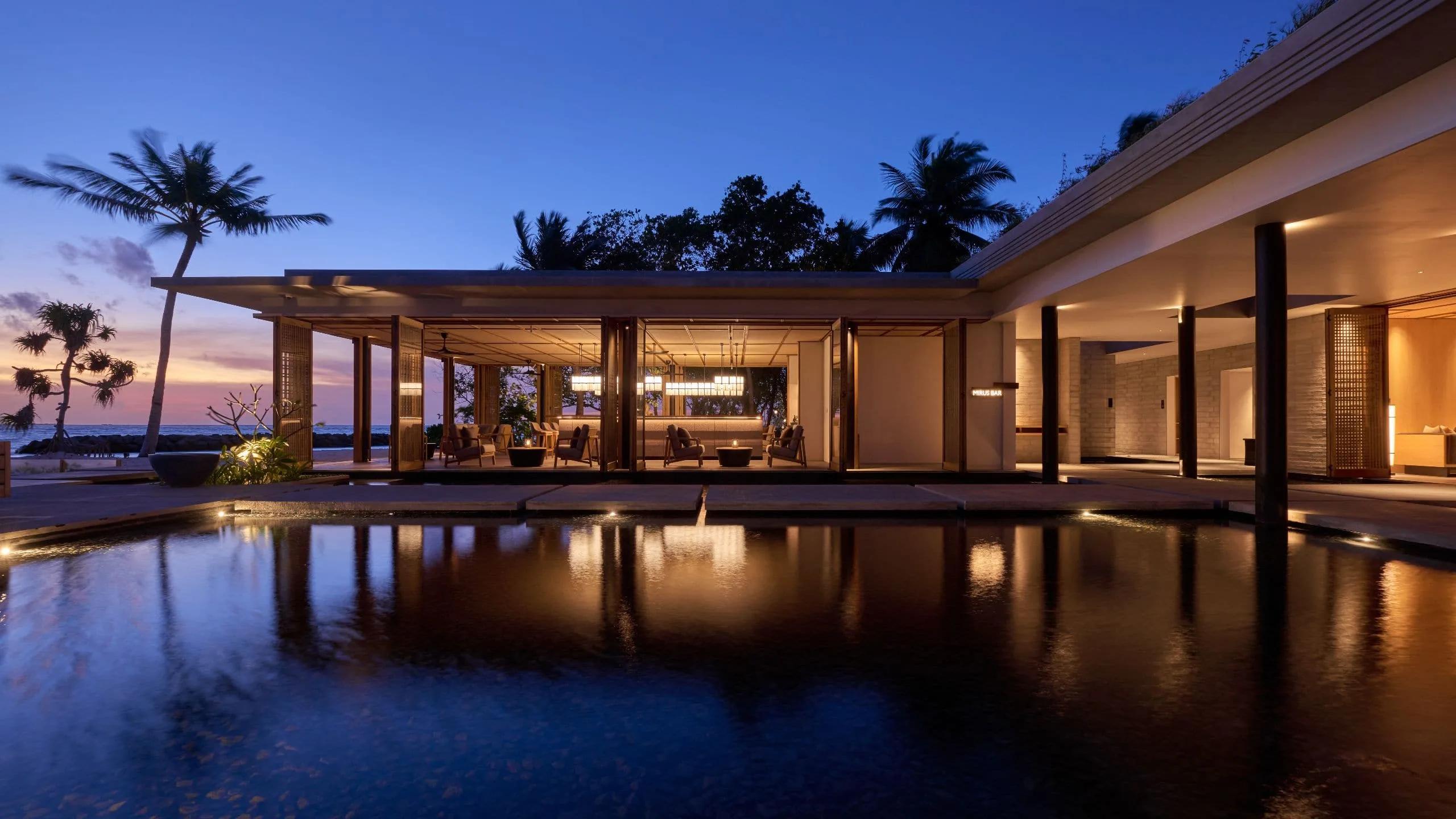 Mirus Bar at sunset, seating angled toward the lagoon