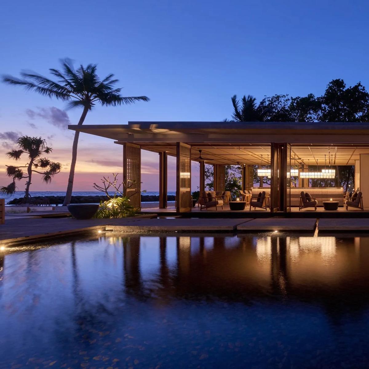 Mirus Bar at sunset, seating angled toward the lagoon