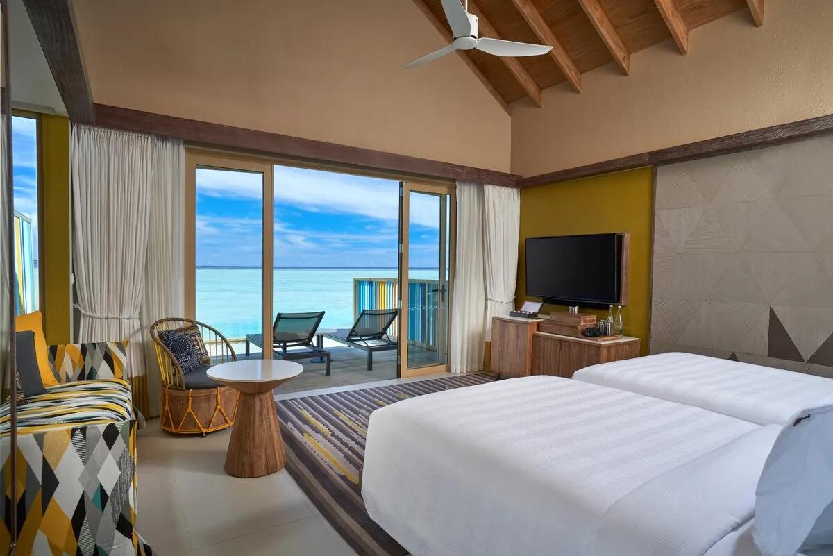 A Platinum-category overwater villa deck over the lagoon — shared research photography with the Platinum Overwater Villa; official site has no separate gallery for the pool variant
