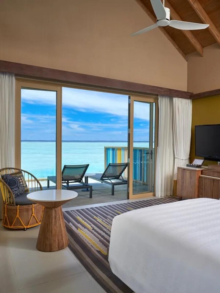 A Platinum-category overwater villa deck over the lagoon — shared research photography with the Platinum Overwater Villa; official site has no separate gallery for the pool variant