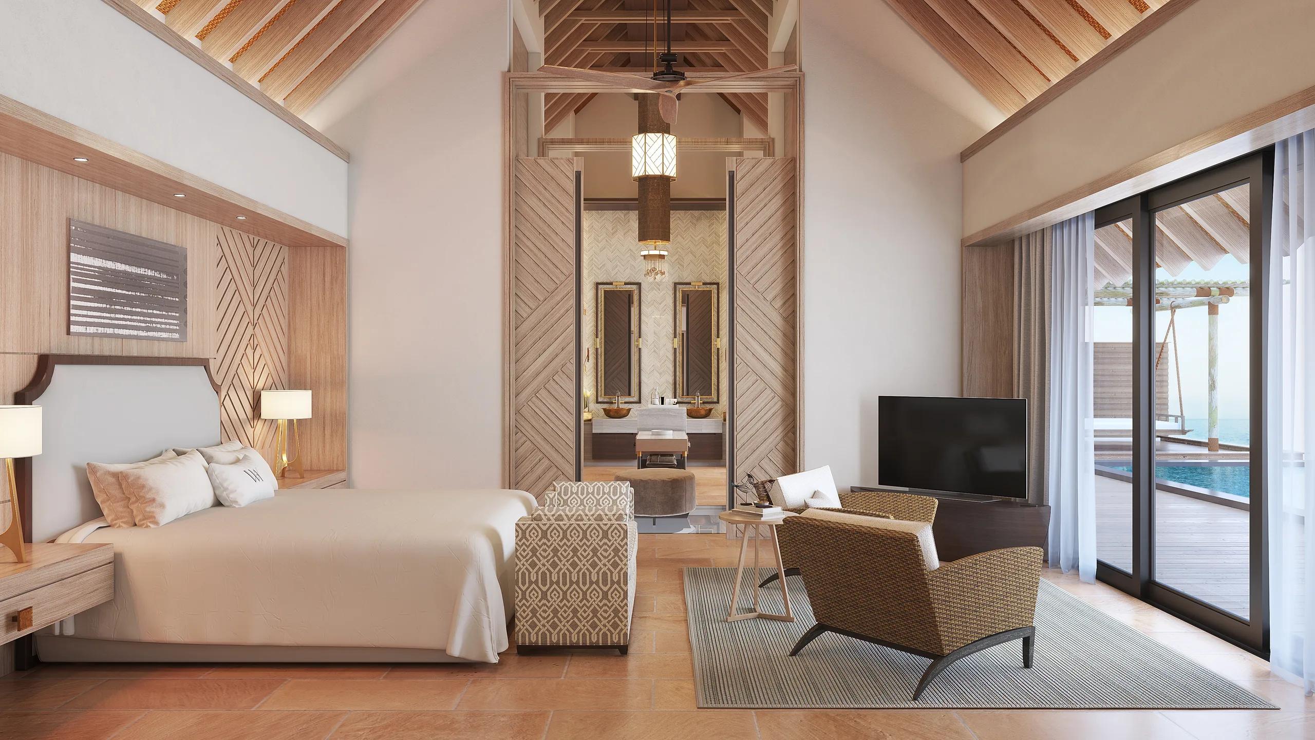 The bedroom of an Overwater Villa at Waldorf Astoria Maldives Ithaafushi, with floor-to-ceiling views of the lagoon — the Two Queen Bedded Overwater Villa has no dedicated published photo, so this sibling overwater-villa image stands in here