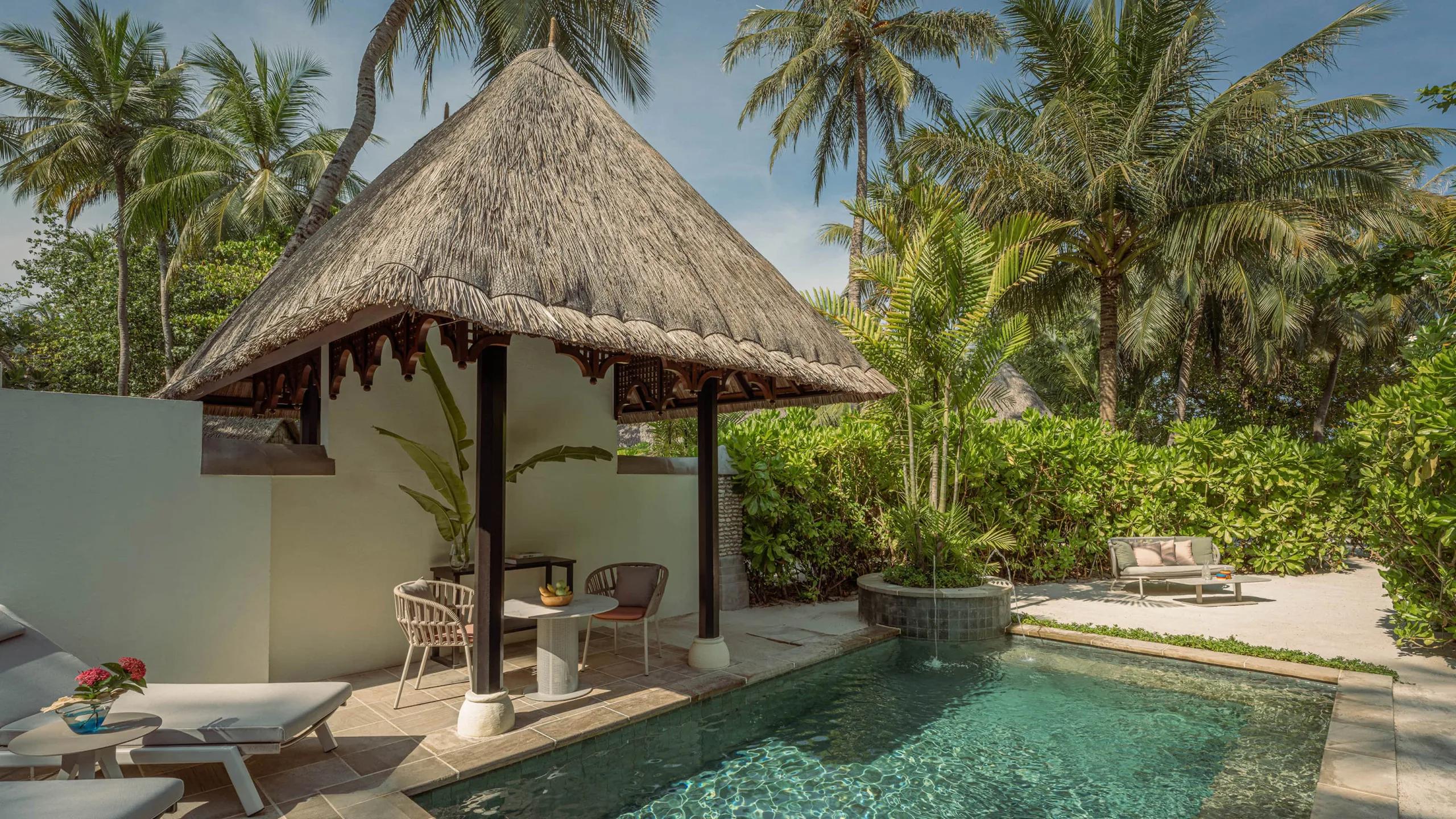 A Garden Pavilion's private pool, set back among palms away from the beach