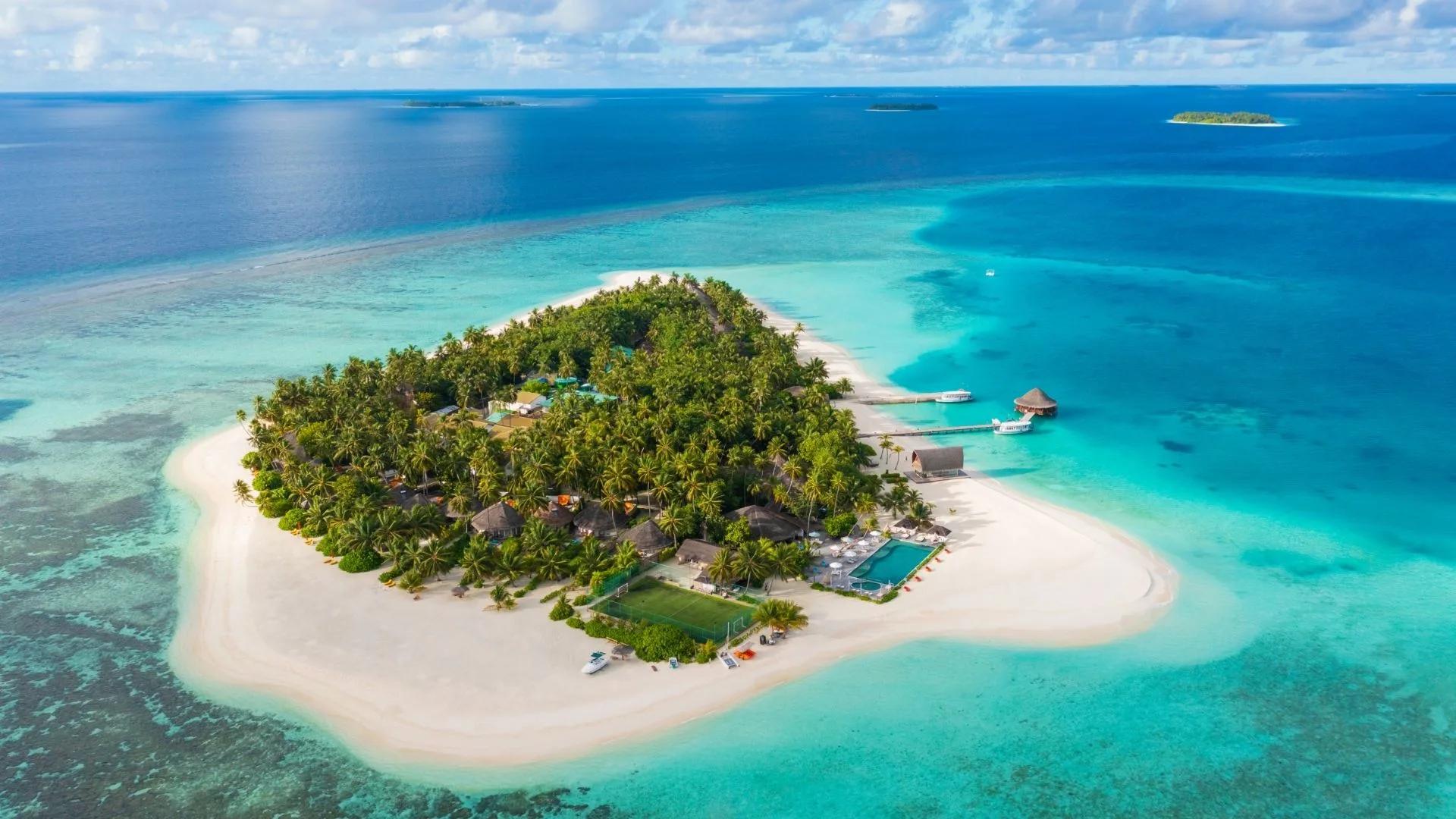 Aerial view of Angsana Velavaru's island and surrounding lagoon in South Nilandhe Atoll