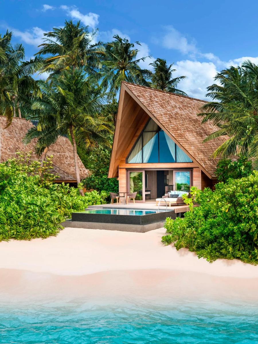 The exterior of a Beach Villa with Pool, set directly on the white sand