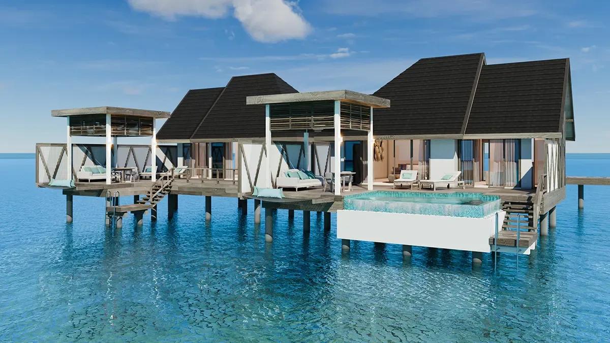 A row of Meyyafushi's 2-Bedroom Water Pool Villas with Slide, overwater decks and pools reaching into the lagoon