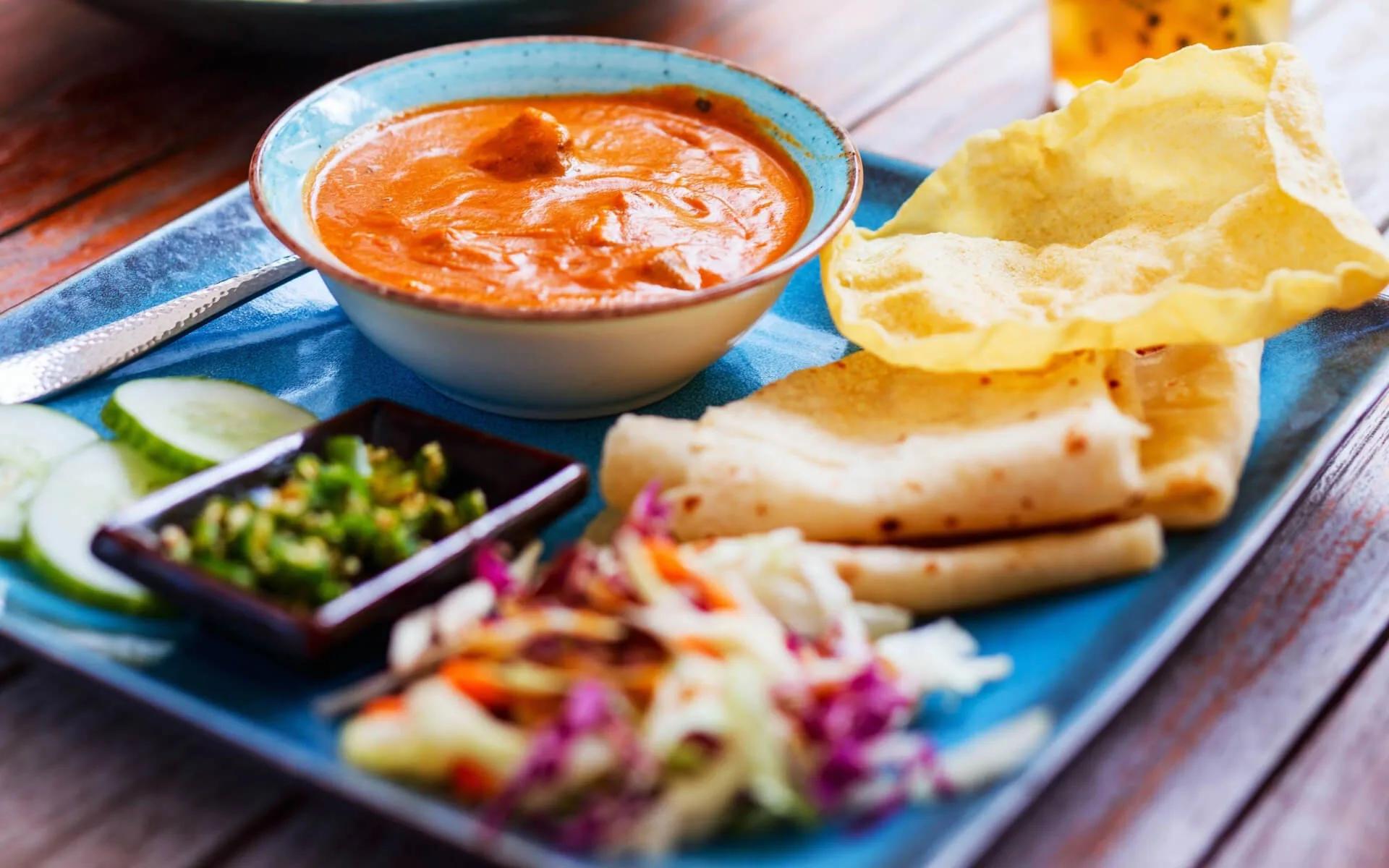 A traditional Maldivian curry plate with roshi and accompaniments, from Malaa's cooking classes