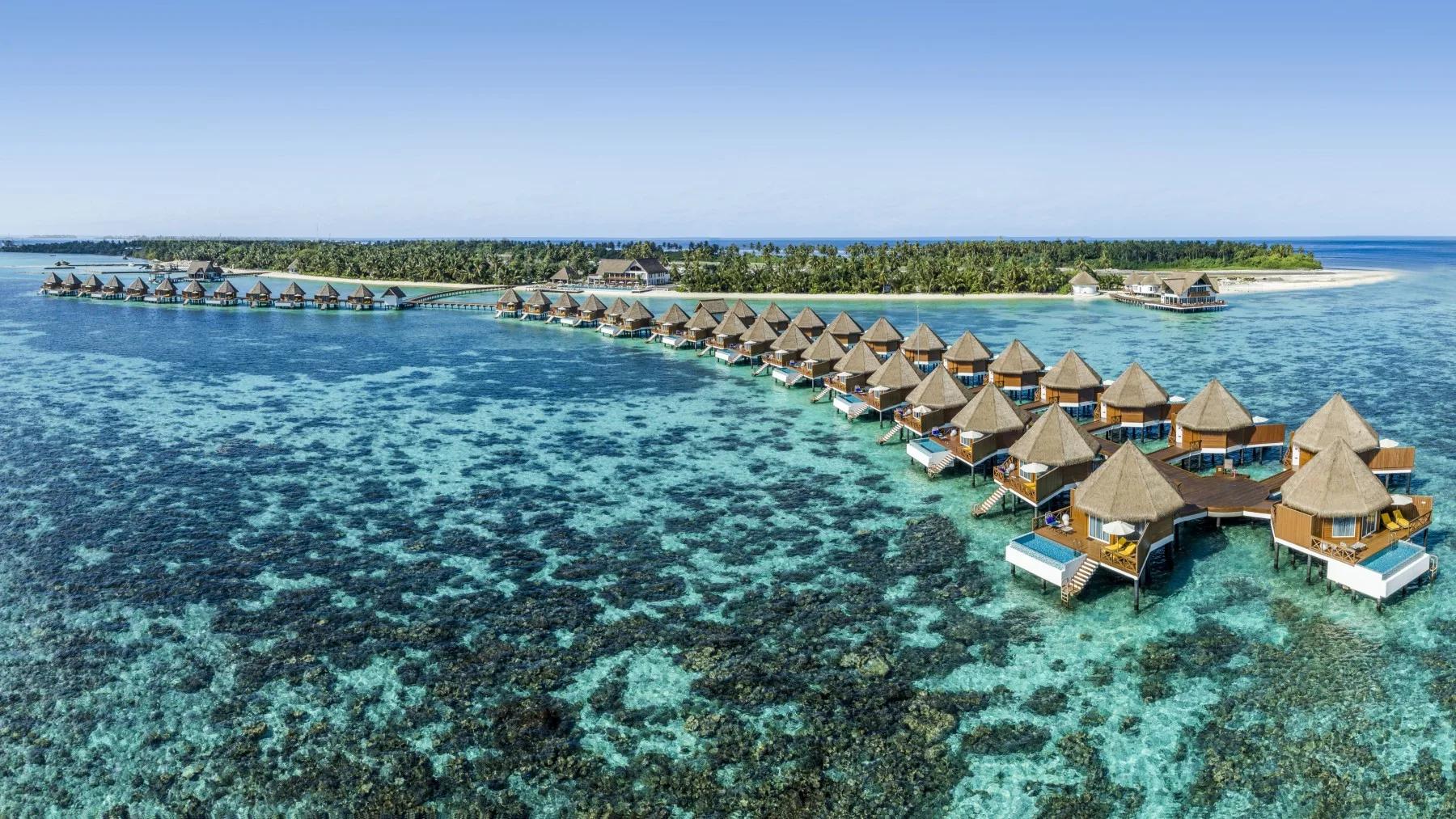 An Overwater Sunset Villa's deck at Mercure Maldives Kooddoo Resort, facing the sunset side of the island