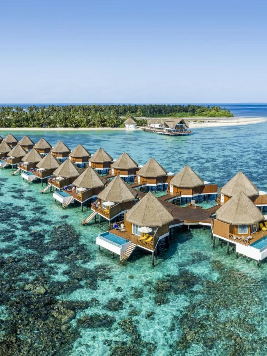 An Overwater Sunset Villa's deck at Mercure Maldives Kooddoo Resort, facing the sunset side of the island