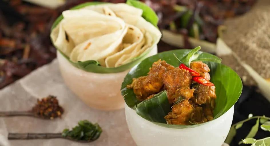 The Spice Spoons cooking school setup at Anantara Dhigu, with ingredients laid out for a class