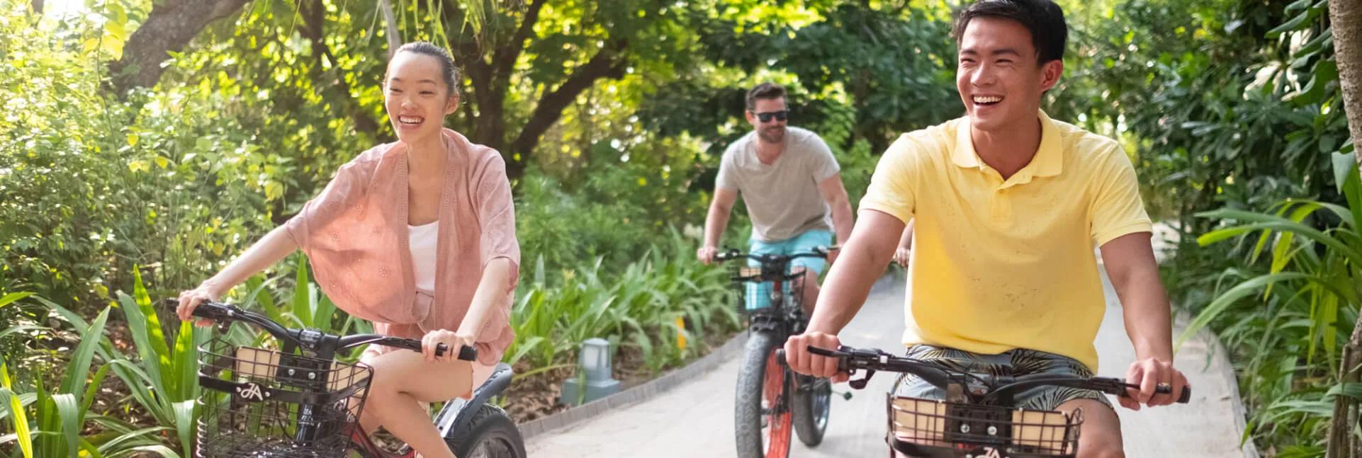 Cycling along JA Manafaru's tree-lined island paths