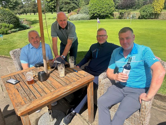 Members on the terrace beside the putting green