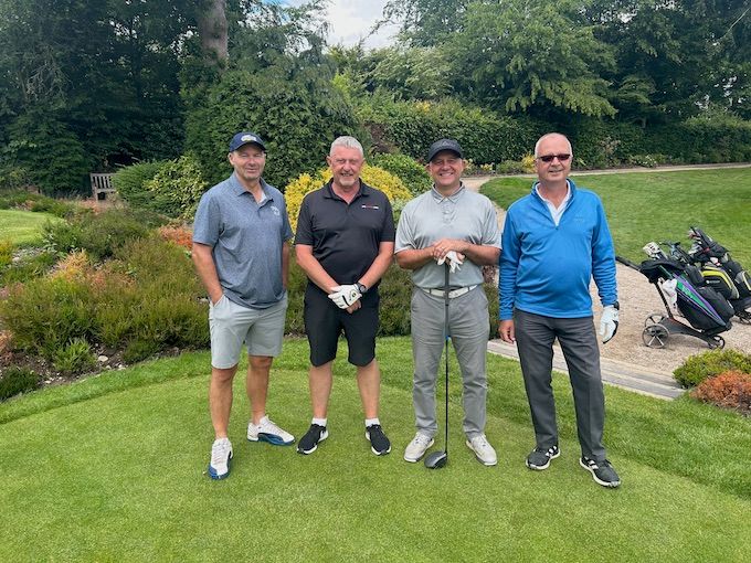 A four-ball in front of the garden borders at Olton