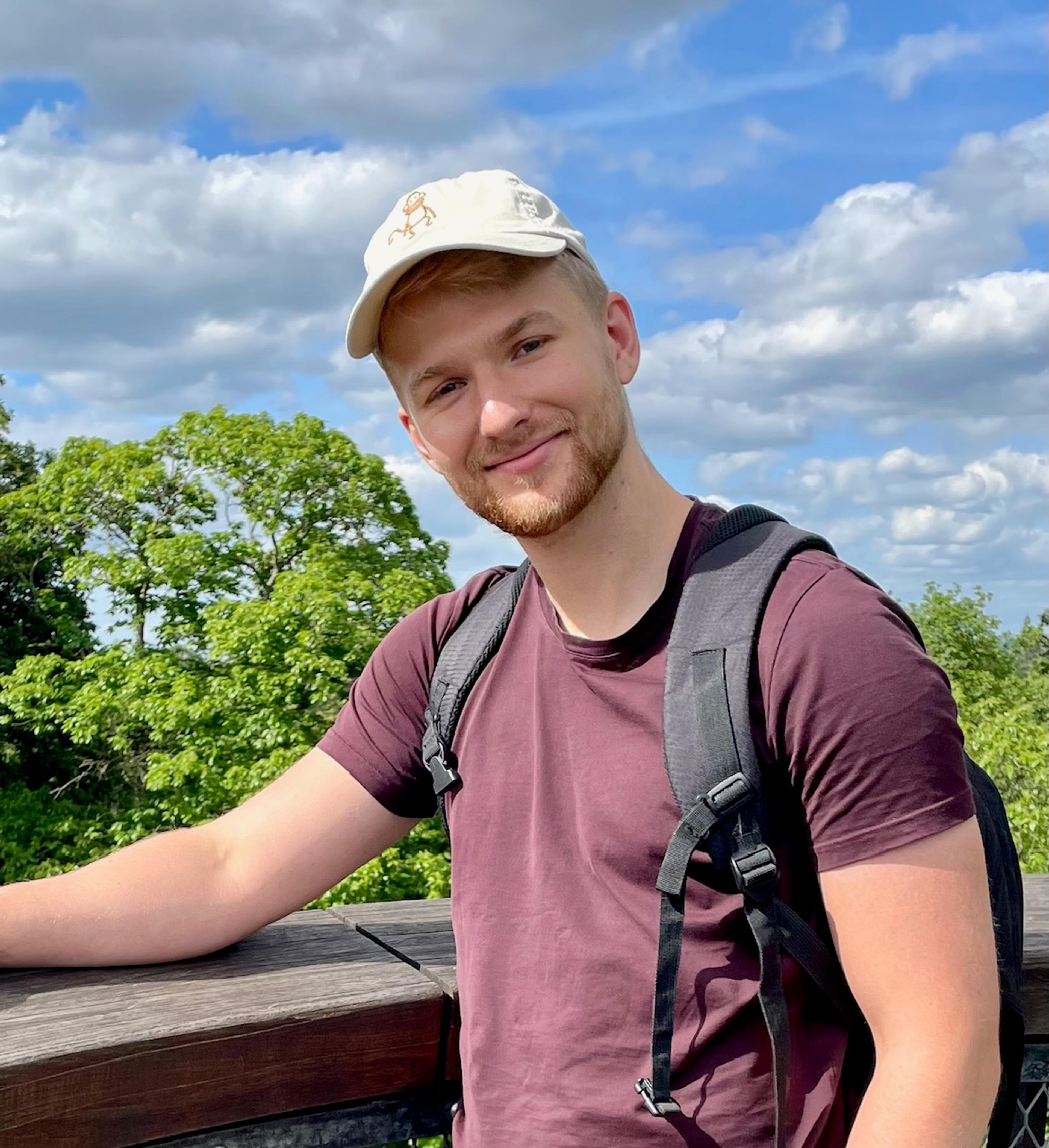 chris is smiling in hiking clothes