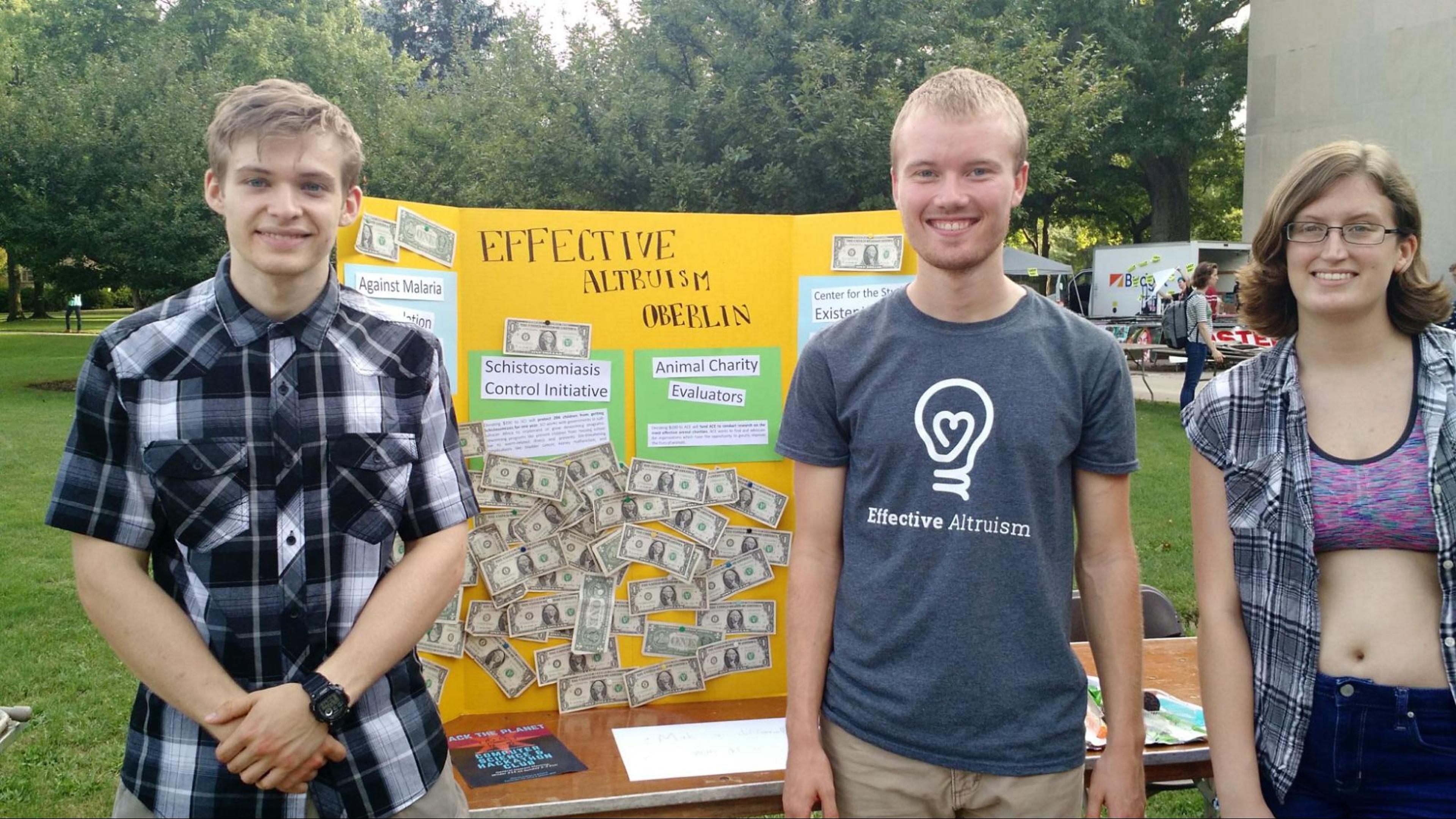 A photo of Haven as a university student, talking to people about effective giving at a student fair.