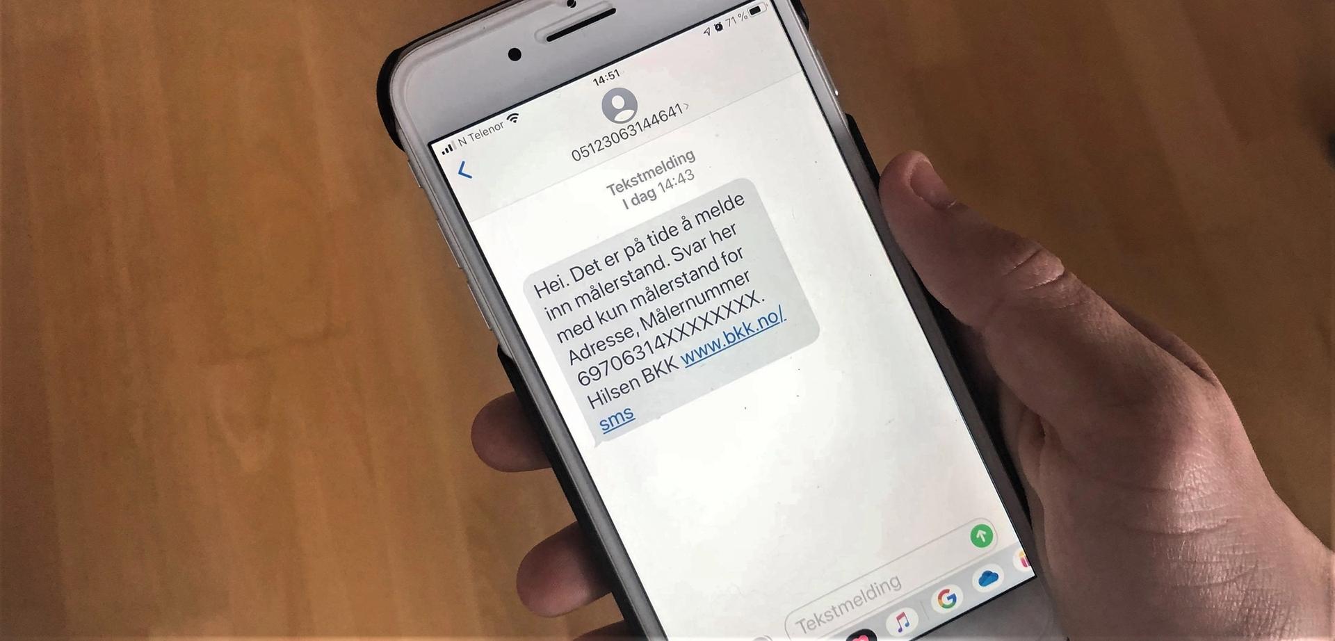 Telefon som viser SMS om måleravlesning