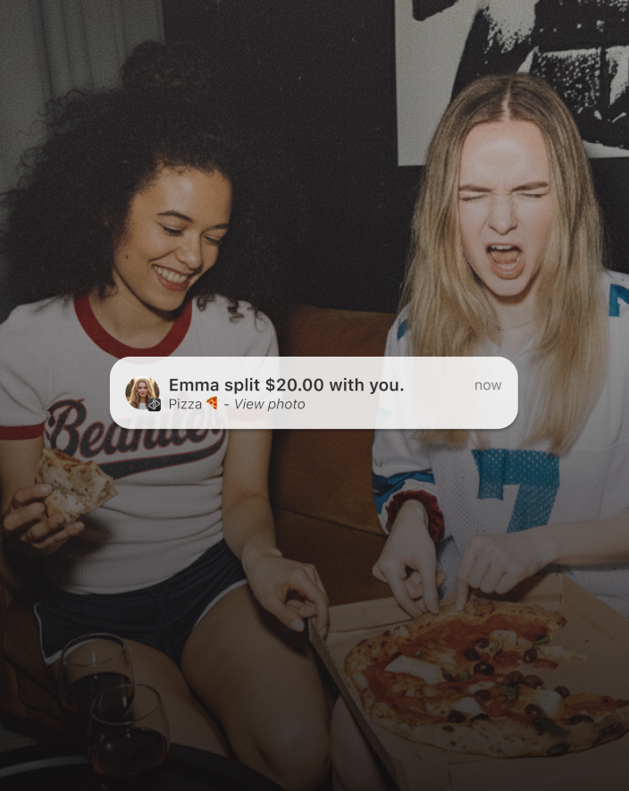 Friends sharing pizza and splitting the bill effortlessly with Bounce