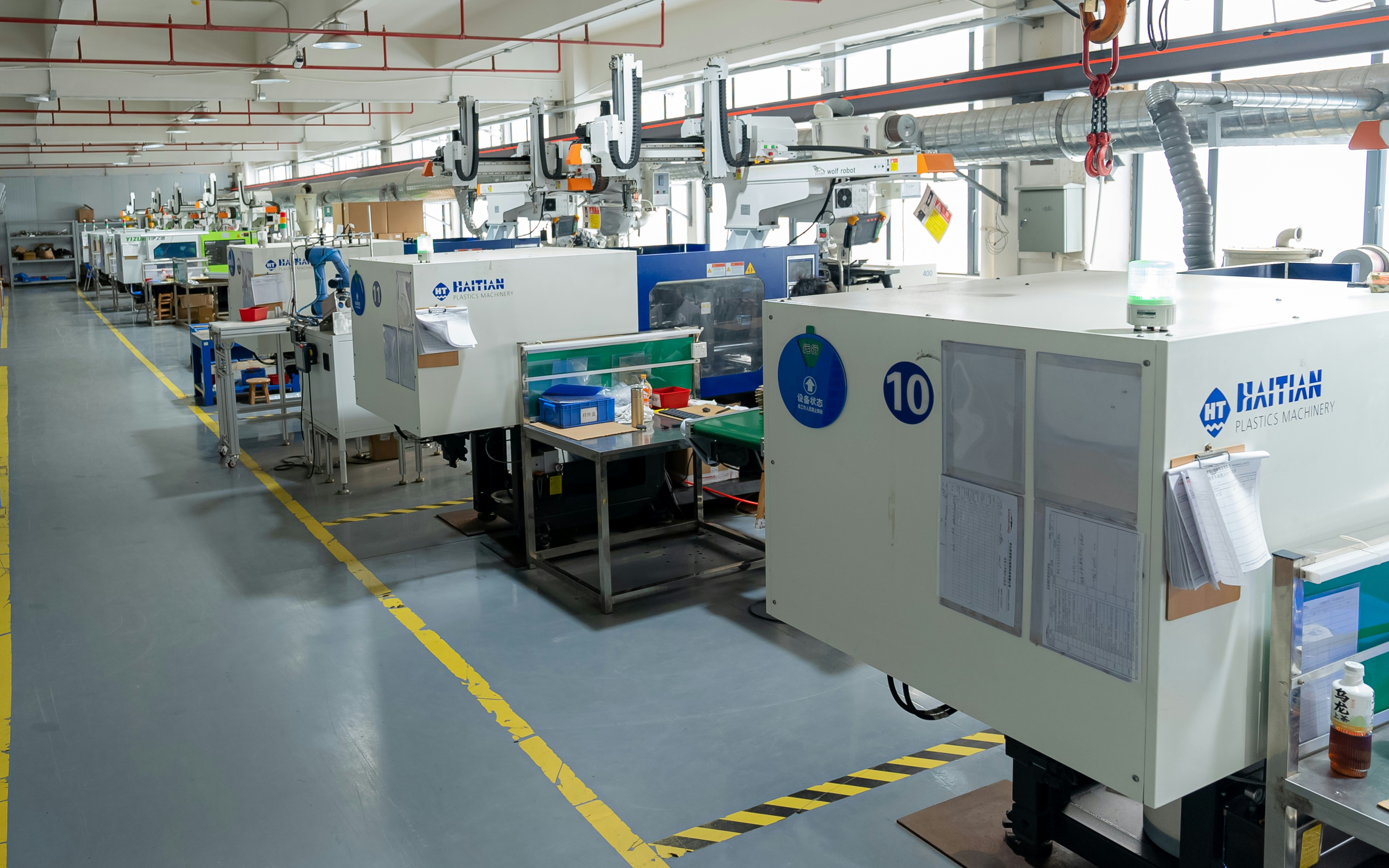 Plastic injection molding machines in production