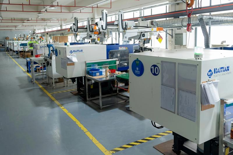 Plastic injection molding machines in production