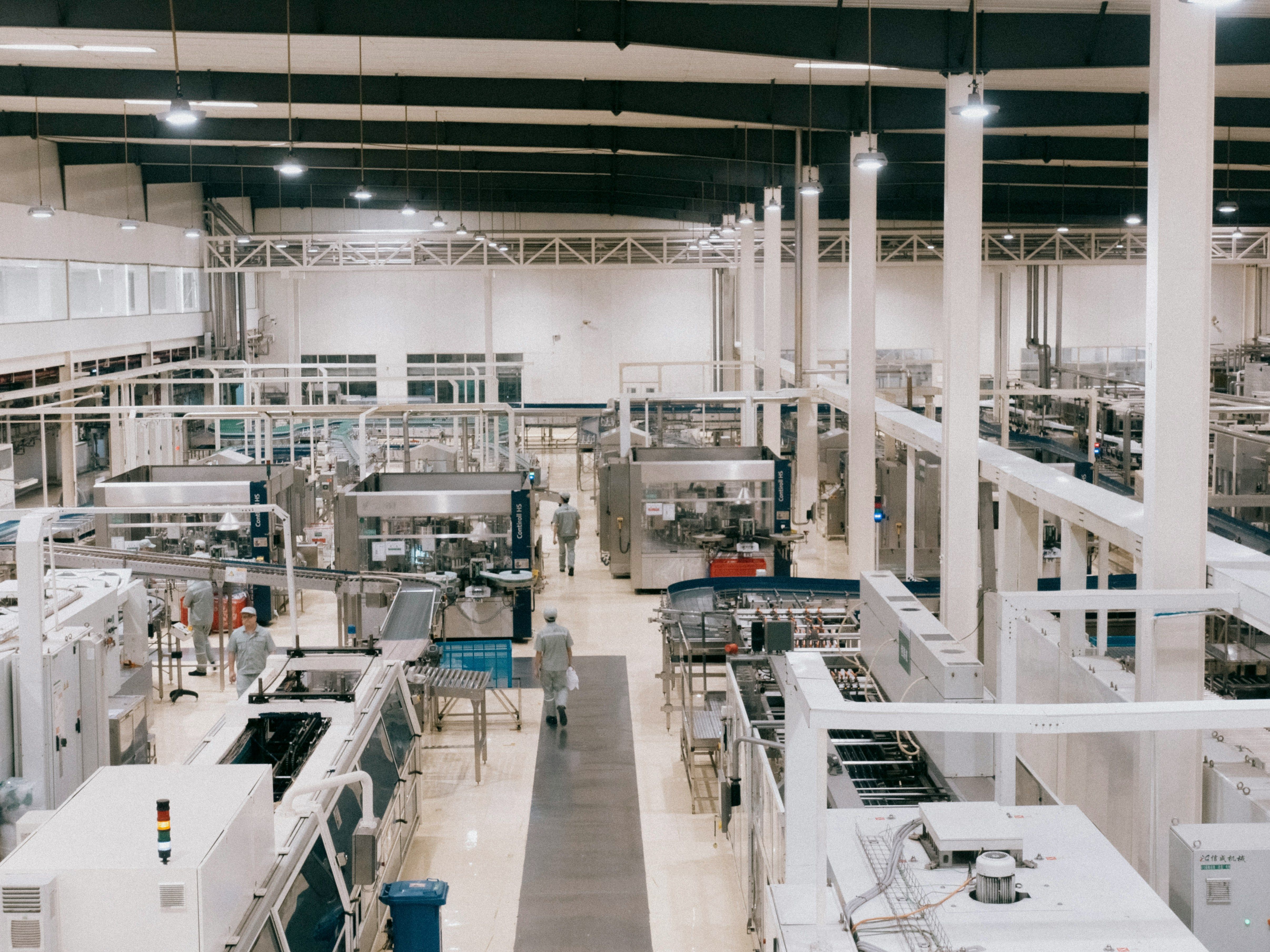 photo of a ready built factory and with factory workers