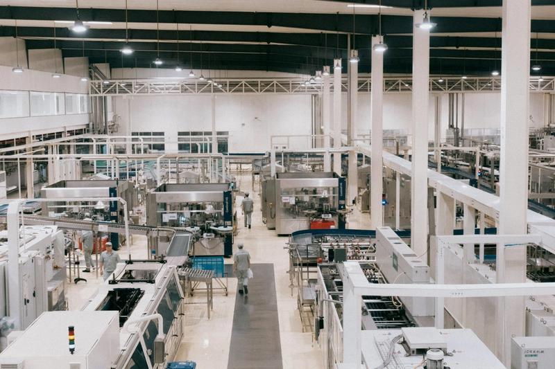 photo of a ready built factory and with factory workers