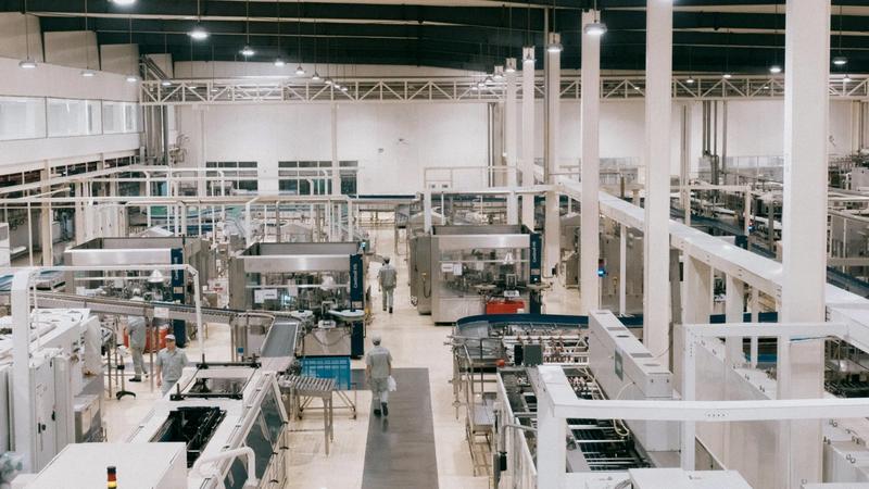 photo of a ready built factory and with factory workers