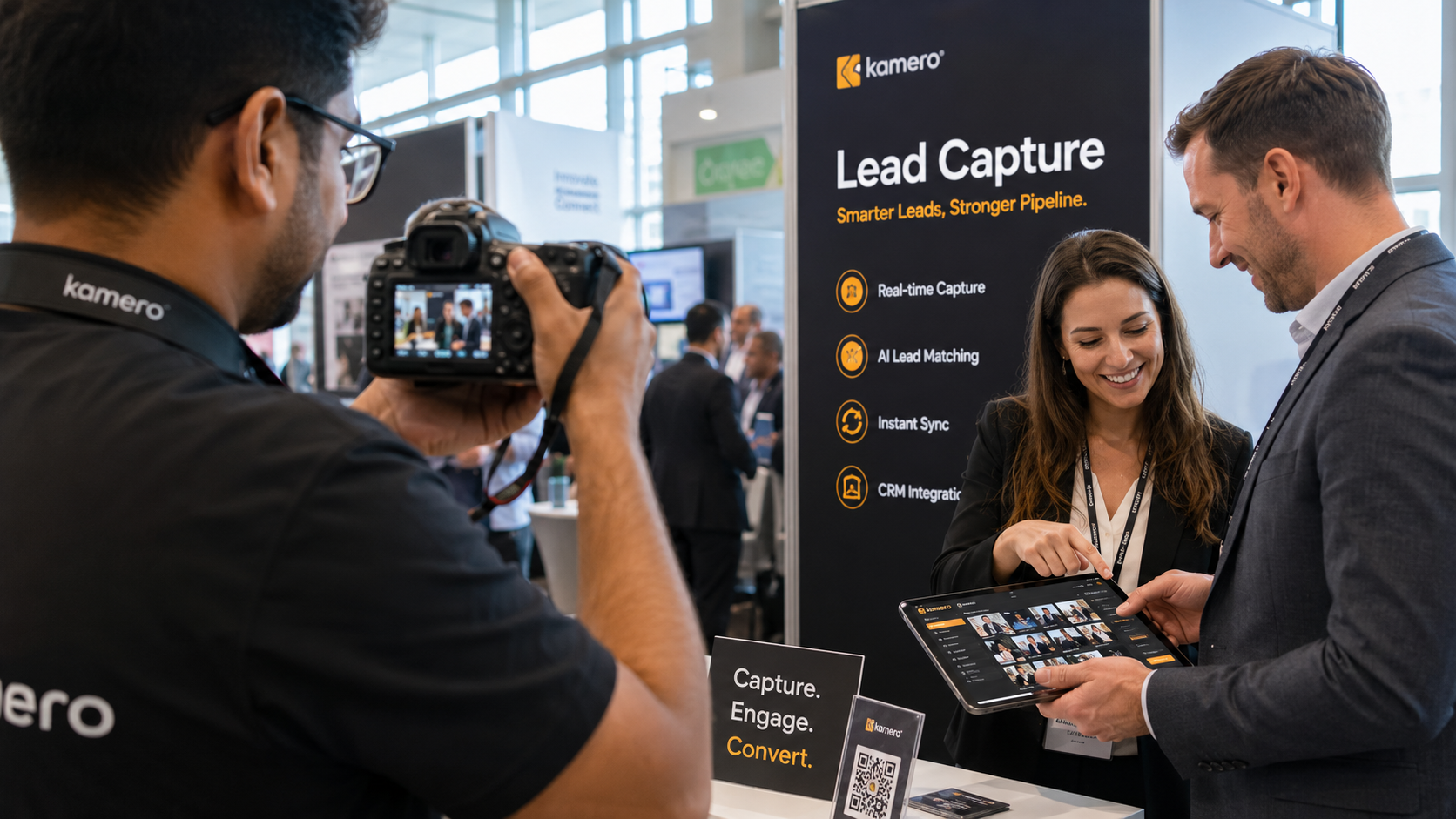 Professional event photographer using a camera with Kam-Sync for real-time camera-to-cloud photo delivery at a busy trade show.