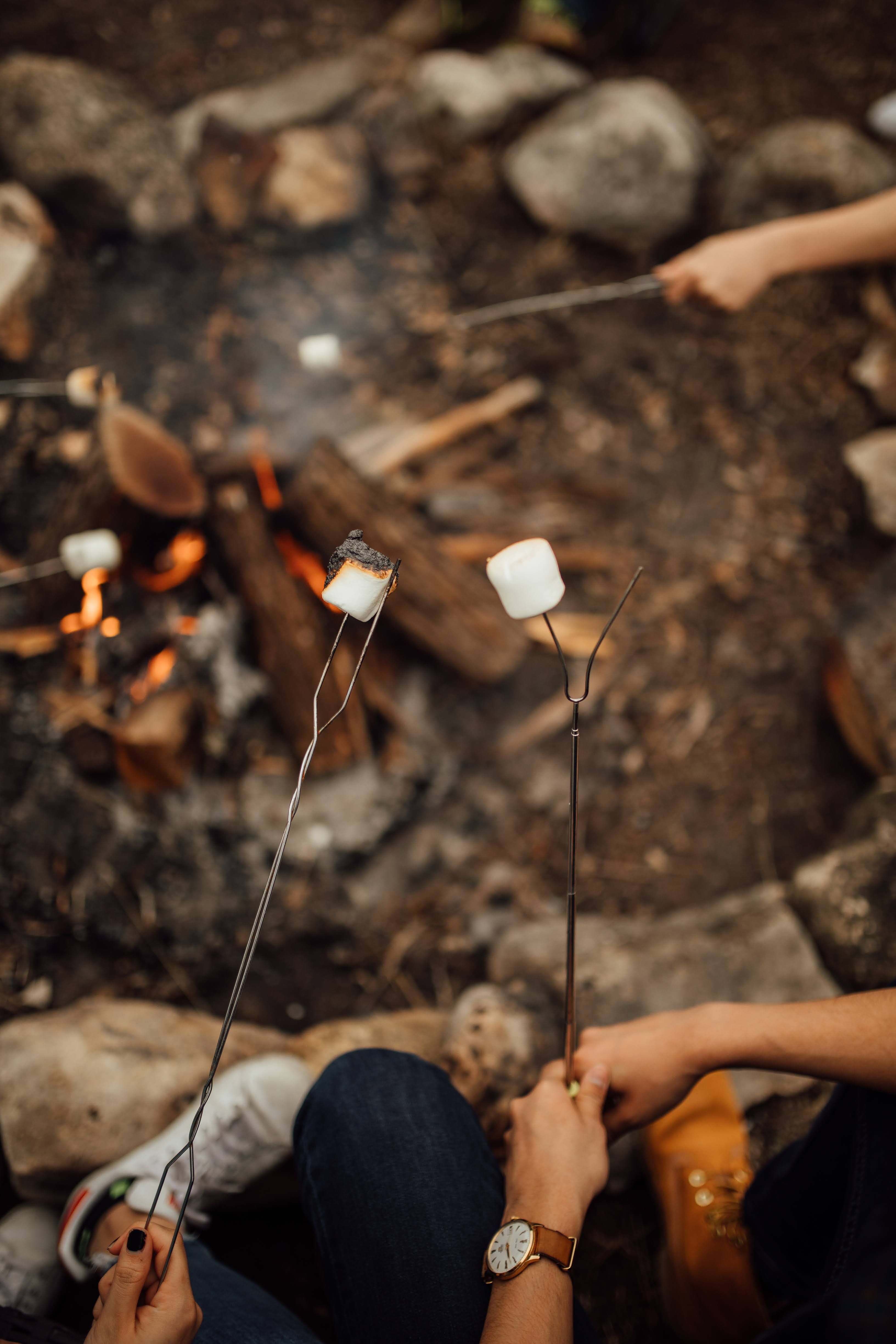 Guests making smores at The Inn Between in Concan, Texas