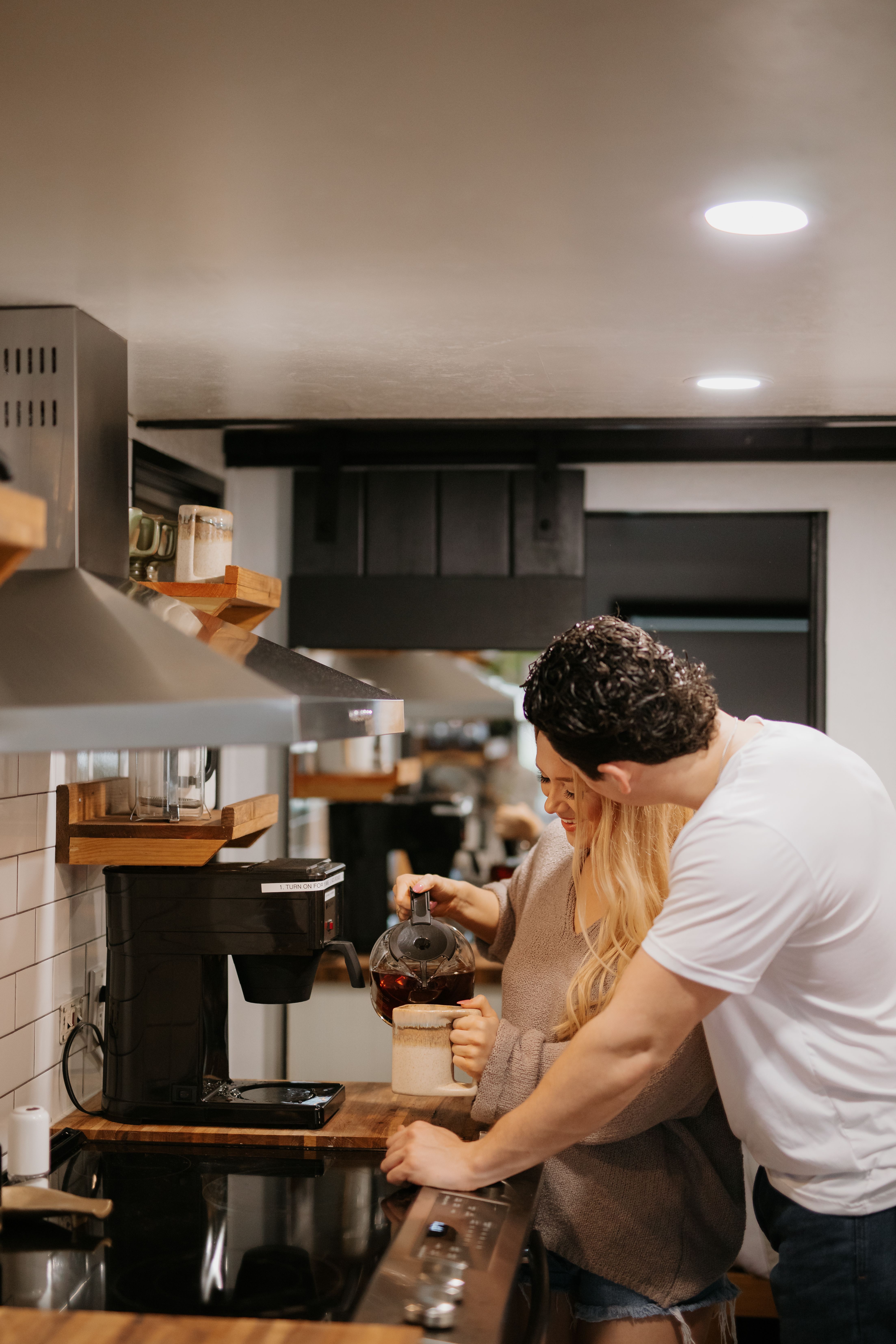 Guests using kitchen at The Inn Between in Concan, Texas
